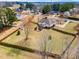 Wonderful aerial view of property with large fenced yard, custom deck and pergola, and well-maintained landscaping at 3112 Gold Dust Ln, Willow Springs, NC 27592