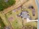 Aerial view of landscaped property with wooden fenced backyard and deck with pergola; includes shed and patio at 3112 Gold Dust Ln, Willow Springs, NC 27592