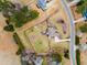Aerial of backyard with wooden fence; shed, patio, and deck with pergola visible at 3112 Gold Dust Ln, Willow Springs, NC 27592