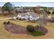 Charming two-story home with inviting landscaping and large mulch beds at 3112 Gold Dust Ln, Willow Springs, NC 27592
