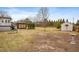 Spacious backyard featuring a custom pergola, shed, and plenty of room for outdoor enjoyment at 3112 Gold Dust Ln, Willow Springs, NC 27592