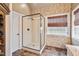 Modern bathroom featuring a glass-enclosed shower, mosaic tile accents, and a stylish window with privacy blinds at 3112 Gold Dust Ln, Willow Springs, NC 27592