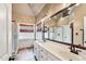 Spa-like bathroom with double vanity, mosaic tile accents, and a glass-enclosed shower, creating a luxurious retreat at 3112 Gold Dust Ln, Willow Springs, NC 27592