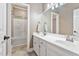 Bright bathroom with double vanity, tile floor and a shower-tub, creating a calm and inviting atmosphere at 3112 Gold Dust Ln, Willow Springs, NC 27592