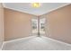 Bright bedroom with soft carpet, two windows, neutral paint and trim, creating a calm and inviting atmosphere at 3112 Gold Dust Ln, Willow Springs, NC 27592
