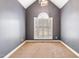 Cozy bedroom showcases a vaulted ceiling with chandelier and a large window with bright natural light at 3112 Gold Dust Ln, Willow Springs, NC 27592