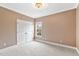 Neutral bedroom featuring plush carpeting, crown molding, and a double door closet at 3112 Gold Dust Ln, Willow Springs, NC 27592