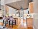 Gourmet kitchen with stainless steel appliances, farmhouse sink, and elegant wooden ceiling at 3112 Gold Dust Ln, Willow Springs, NC 27592