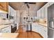 Modern kitchen with stainless steel appliances, wooden ceiling and white cabinets at 3112 Gold Dust Ln, Willow Springs, NC 27592