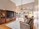 Spacious living room with beautiful hardwood floors and a fireplace, creating a cozy and inviting atmosphere at 3112 Gold Dust Ln, Willow Springs, NC 27592