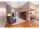 Inviting living room showcases a high ceiling, beautiful floors, and an open layout to the kitchen and entryway at 3112 Gold Dust Ln, Willow Springs, NC 27592