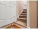 Carpeted stairway leads to the next level of the home at 3112 Gold Dust Ln, Willow Springs, NC 27592