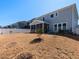 View of the home's backyard featuring a privacy fence and a screened-in porch at 3354 Brunot St, New Hill, NC 27562