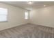 Bedroom featuring neutral walls, carpet, two windows providing ample natural light and recessed lighting at 3354 Brunot St, New Hill, NC 27562