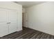 Bright bedroom with closet, hardwood floors, white trim, and neutral paint create a peaceful retreat at 3354 Brunot St, New Hill, NC 27562