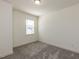 Bedroom featuring neutral walls and carpet with window providing ample natural light at 3354 Brunot St, New Hill, NC 27562