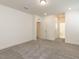 Bedroom featuring neutral walls, carpet, with doors to bathroom and closet/storage areas at 3354 Brunot St, New Hill, NC 27562