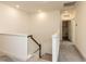 Upstairs hallway with carpet and view of laundry room at 3354 Brunot St, New Hill, NC 27562