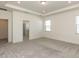 Bright, carpeted main bedroom with tray ceiling, adjacent to the main bathroom at 3354 Brunot St, New Hill, NC 27562