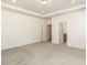 Bright, carpeted main bedroom with tray ceiling and view of the main bathroom at 3354 Brunot St, New Hill, NC 27562