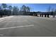 View of the community parking lot with meticulously manicured trees and landscaping at 3354 Brunot St, New Hill, NC 27562