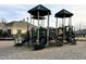 Community playground features slides, climbing structures, and shaded areas for enjoyment at 3381 Lovage Dr, Apex, NC 27502
