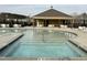 Community swimming pool with a wading area, ample seating, and a shaded pavilion for relaxation at 3381 Lovage Dr, Apex, NC 27502