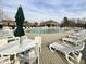 Relaxing community pool area with lounge chairs, tables, and umbrellas for a resort-like experience at 3381 Lovage Dr, Apex, NC 27502