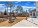 Backyard featuring a play set and a covered porch with string lights at 3381 Lovage Dr, Apex, NC 27502