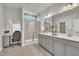 Bathroom features a double vanity, large mirror, shower, and tiled floors at 3381 Lovage Dr, Apex, NC 27502