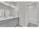 Bathroom with double sink vanity and large mirror in addition to a shower and tub at 3381 Lovage Dr, Apex, NC 27502