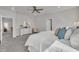 Bright bedroom features plush carpet, ceiling fan, and white dresser with mirror at 3381 Lovage Dr, Apex, NC 27502