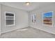 Well lit bedroom featuring carpeted floors and three bright windows with views of the property at 3381 Lovage Dr, Apex, NC 27502