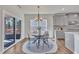 Charming dining room featuring a round table, stylish chairs, and sliding glass doors at 3381 Lovage Dr, Apex, NC 27502