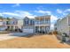 Inviting two-story home featuring a stylish exterior, covered porch, and well-maintained landscaping at 3381 Lovage Dr, Apex, NC 27502