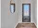 Bright foyer featuring luxury vinyl flooring and an elegant decorative front door at 3381 Lovage Dr, Apex, NC 27502