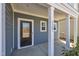 Inviting front porch featuring a glass-paneled front door and classic design at 3381 Lovage Dr, Apex, NC 27502