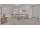 Inviting living room with plush seating, a decorative TV stand, and natural light at 3381 Lovage Dr, Apex, NC 27502