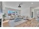 Sunlit living room with neutral tones, comfortable seating, and stylish finishes at 3381 Lovage Dr, Apex, NC 27502
