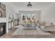 Cozy living room featuring modern décor, natural light, and hardwood floors at 3381 Lovage Dr, Apex, NC 27502