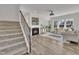 Bright living room with fireplace, comfortable seating, and hardwood flooring at 3381 Lovage Dr, Apex, NC 27502