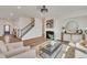 Spacious living room with an open floor plan and a fireplace as the focal point at 3381 Lovage Dr, Apex, NC 27502