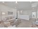 Upstairs living room with a comfortable couch, neutral paint, and lots of light at 3381 Lovage Dr, Apex, NC 27502