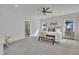 Spacious main bedroom featuring a ceiling fan, windows for natural light, and an ensuite bathroom at 3381 Lovage Dr, Apex, NC 27502