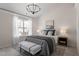 Charming bedroom featuring a large window and elegant decor at 3439 Archdale Dr, Raleigh, NC 27614