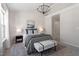 Bright primary bedroom with a decorative bench and stylish accents at 3439 Archdale Dr, Raleigh, NC 27614