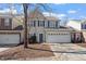 Charming two-story home with blue shutters, attached garage, and well-manicured front yard at 3439 Archdale Dr, Raleigh, NC 27614