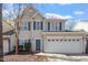 Charming two-story home with a two-car garage and blue shutters at 3439 Archdale Dr, Raleigh, NC 27614