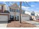 Two-story home with blue shutters, an attached two-car garage, and a well-maintained front yard at 3439 Archdale Dr, Raleigh, NC 27614