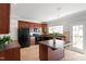 Spacious kitchen showcasing dark wood cabinets, modern appliances, an island, and a bright, airy feel at 3439 Archdale Dr, Raleigh, NC 27614